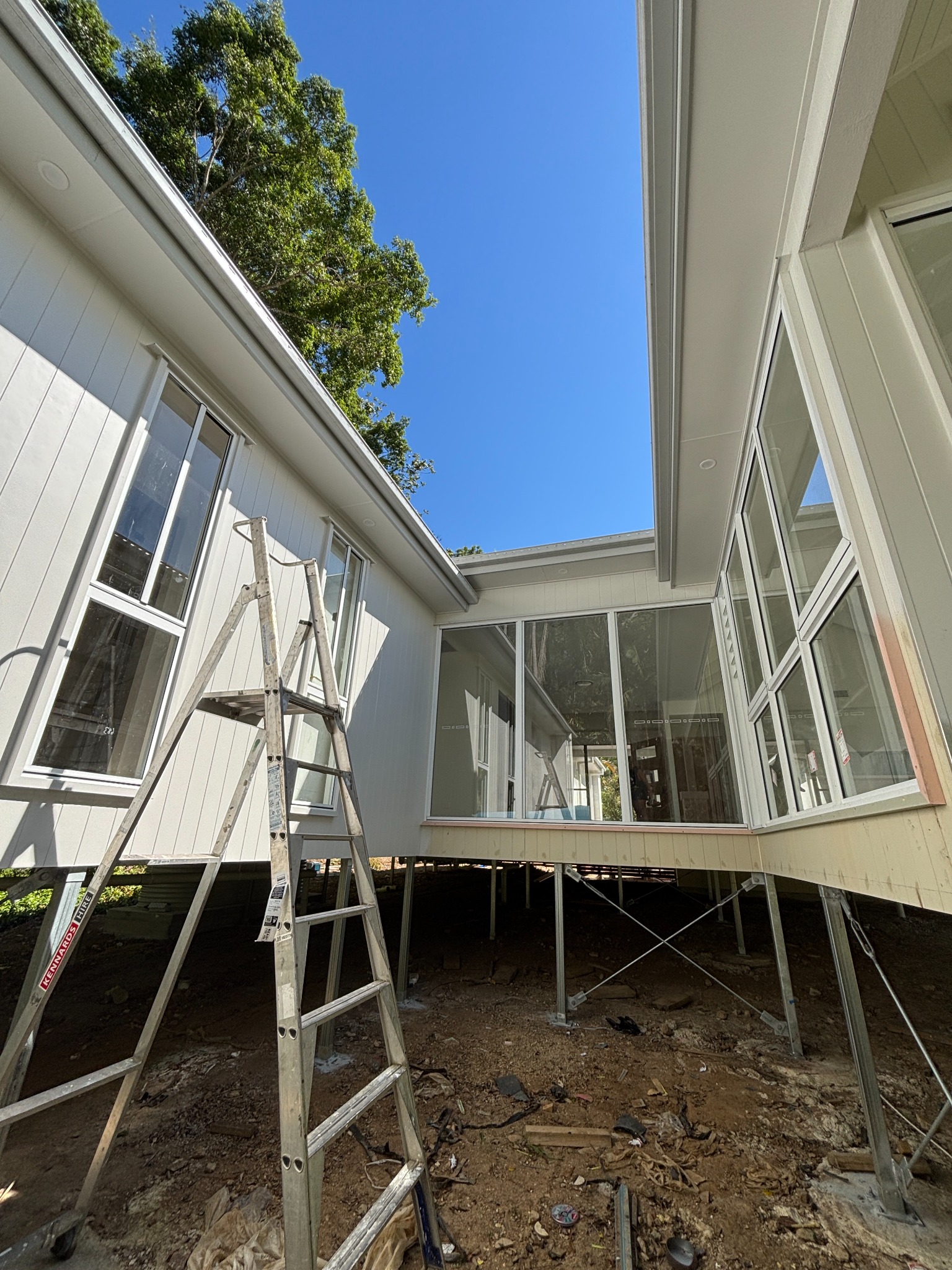 Courtyard windows and ladder at a new-build window cleaning job